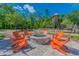 Outdoor fire pit area with comfortable seating, ideal for gatherings at 17628 Breakaway St, Land O Lakes, FL 34638