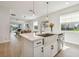 Bright, modern kitchen featuring a stainless steel farmhouse sink and open layout with seamless flow to living spaces at 17628 Breakaway St, Land O Lakes, FL 34638