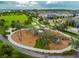 Community playground featuring modern play structures, slides, and shaded areas at 17628 Breakaway St, Land O Lakes, FL 34638