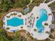 Aerial shot of the community pool featuring spacious lounging and shaded areas at 17628 Breakaway St, Land O Lakes, FL 34638