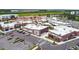 Wide aerial view of a retail shopping center, showcasing stores and ample parking spaces at 17628 Breakaway St, Land O Lakes, FL 34638