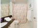 Bathroom featuring a vanity with granite countertop and marble floors at 18934 Avenue Biarritz, Lutz, FL 33558