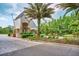 Elegant gated community entrance featuring lush landscaping and beautiful stone accents at 18934 Avenue Biarritz, Lutz, FL 33558