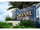 Entrance sign for CHEVAL featuring lush landscaping and sky background at 18934 Avenue Biarritz, Lutz, FL 33558