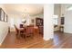 Open floor plan dining area featuring a large window, hard wood floor and elegant furniture at 18934 Avenue Biarritz, Lutz, FL 33558