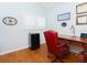 Office featuring hardwood floors, desk and comfortable leather chair at 18934 Avenue Biarritz, Lutz, FL 33558