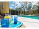 Enclosed pool area with cool drinks and comfortable patio seating at 18934 Avenue Biarritz, Lutz, FL 33558