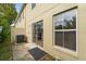 A relaxing back patio with sliding glass doors, perfect for outdoor enjoyment and easy access to the home at 2032 Sunset Meadow Dr, Clearwater, FL 33763