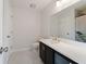 Well-lit bathroom with white marble floors, modern vanity, and a neutral color scheme at 2032 Sunset Meadow Dr, Clearwater, FL 33763