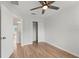 Clean bedroom featuring wood-look floors and closet at 2032 Sunset Meadow Dr, Clearwater, FL 33763