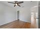 Clean bedroom featuring wood-look floors and ceiling fan at 2032 Sunset Meadow Dr, Clearwater, FL 33763