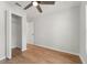 A bedroom featuring wood floors, neutral color scheme, ceiling fan, and closet at 2032 Sunset Meadow Dr, Clearwater, FL 33763