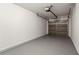 A well-lit, clean garage with painted floor, door, and walls at 2032 Sunset Meadow Dr, Clearwater, FL 33763