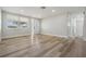 Inviting living space featuring new flooring, neutral walls, and ample natural light at 2043 Erin Dr, Holiday, FL 34690