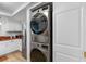 The laundry closet features a stacked washer and dryer at 2583 Countryside Blvd # 3212, Clearwater, FL 33761