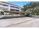 Assigned covered parking near building entrance and beautifully landscaped grounds at 2583 Countryside Blvd # 3212, Clearwater, FL 33761