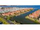 Aerial view of waterfront townhouses with boat docks and a water view at 2717 Via Cipriani # 623B, Clearwater, FL 33764