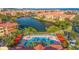 Aerial view of the community pool, lounge chairs, and cabanas at 2717 Via Cipriani # 623B, Clearwater, FL 33764