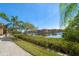 A view of the waterfront pathway with the community homes and docks in the background at 2717 Via Cipriani # 623B, Clearwater, FL 33764