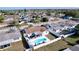 Aerial shot of home featuring an inviting private pool, fenced yard and outdoor seating at 3142 Domino Dr, Holiday, FL 34691