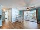 Dining area featuring tile flooring, a ceiling fan, seating, and outdoor views through sliding glass doors at 3142 Domino Dr, Holiday, FL 34691