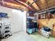 Garage with a door, storage, organization, and a painted cement floor at 3142 Domino Dr, Holiday, FL 34691