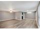 Bright living room with neutral walls, light-colored flooring, ceiling fan, and abundant natural light at 3544 Landale Dr, Holiday, FL 34691