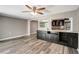 Living room featuring a wet bar and access to kitchen at 3544 Landale Dr, Holiday, FL 34691