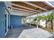 Covered patio with exposed rafters, perfect for outdoor relaxation and entertaining, blending indoor-outdoor living at 3544 Landale Dr, Holiday, FL 34691