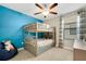 Bedroom featuring a bunk bed, ceiling fan, carpeted floors, and a comfy bean bag chair at 3568 Pine Ribbon Dr, Land O Lakes, FL 34638