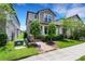 Exterior view of home featuring manicured landscaping, lawn and covered entry at 3568 Pine Ribbon Dr, Land O Lakes, FL 34638