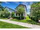 Exterior view of home featuring manicured landscaping, lawn and covered entry at 3568 Pine Ribbon Dr, Land O Lakes, FL 34638