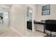 Hallway leading to a bathroom and an office space, highlighting the home's layout at 3568 Pine Ribbon Dr, Land O Lakes, FL 34638