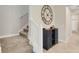 Carpeted staircase with an open cabinet that has wine bottle storage at 3568 Pine Ribbon Dr, Land O Lakes, FL 34638