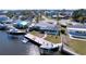 Aerial view of waterfront home featuring a pool, dock, and boat lift at 4941 Waterside Dr, Port Richey, FL 34668