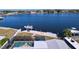 This aerial shot showcases the backyard screened pool, boat dock and waterfront view at 4941 Waterside Dr, Port Richey, FL 34668