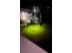 View of a boat motor illuminated by green underwater lights off a private dock at 4941 Waterside Dr, Port Richey, FL 34668