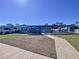 Exterior view of backyard with patio and RV parked in drive at 4941 Waterside Dr, Port Richey, FL 34668