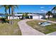 Inviting waterfront home with circular driveway and boat house at 4941 Waterside Dr, Port Richey, FL 34668