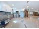 Bright kitchen remodel showcasing modern white cabinets and stainless steel appliances against terrazzo flooring at 4941 Waterside Dr, Port Richey, FL 34668