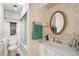 Bathroom with shower/tub combo, white vanity, and neutral color scheme at 5125 Jo St, Zephyrhills, FL 33542