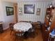 Cozy dining room with hardwood floors, a floral tablecloth, and wood furniture at 5125 Jo St, Zephyrhills, FL 33542