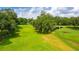 Scenic view of a well-maintained golf course featuring mature trees and open green spaces at 5125 Jo St, Zephyrhills, FL 33542