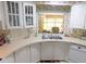 Well-lit kitchen with a window over the sink and white appliances at 5125 Jo St, Zephyrhills, FL 33542