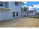 Exterior of house showing a large wooden back deck with access to the yard at 535 28Th N Ave, St Petersburg, FL 33704