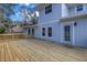 Exterior of house with a large wooden back deck with access to the backyard at 535 28Th N Ave, St Petersburg, FL 33704