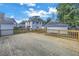 Large wooden back deck with a detached garage and partial view of the yard at 535 28Th N Ave, St Petersburg, FL 33704