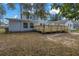 Back exterior view with new wooden deck offering space for outdoor enjoyment at 535 28Th N Ave, St Petersburg, FL 33704