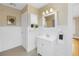 Bathroom featuring checkered floors, wainscoting, and a vintage vanity at 535 28Th N Ave, St Petersburg, FL 33704