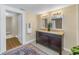 Bathroom with a double vanity, soft lighting, and tile floors at 535 28Th N Ave, St Petersburg, FL 33704